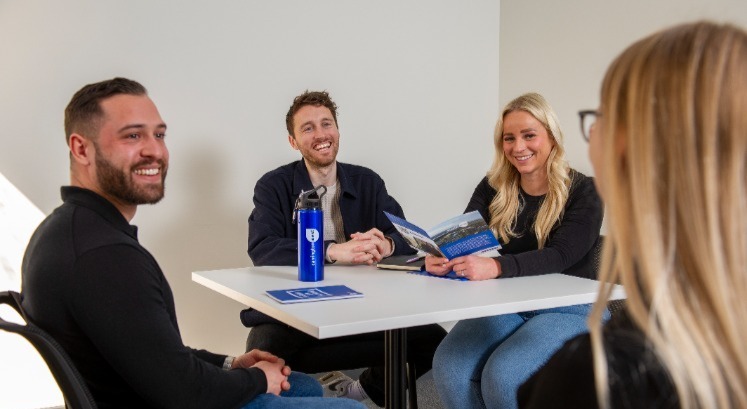 Recruitment consultants in a team meeting